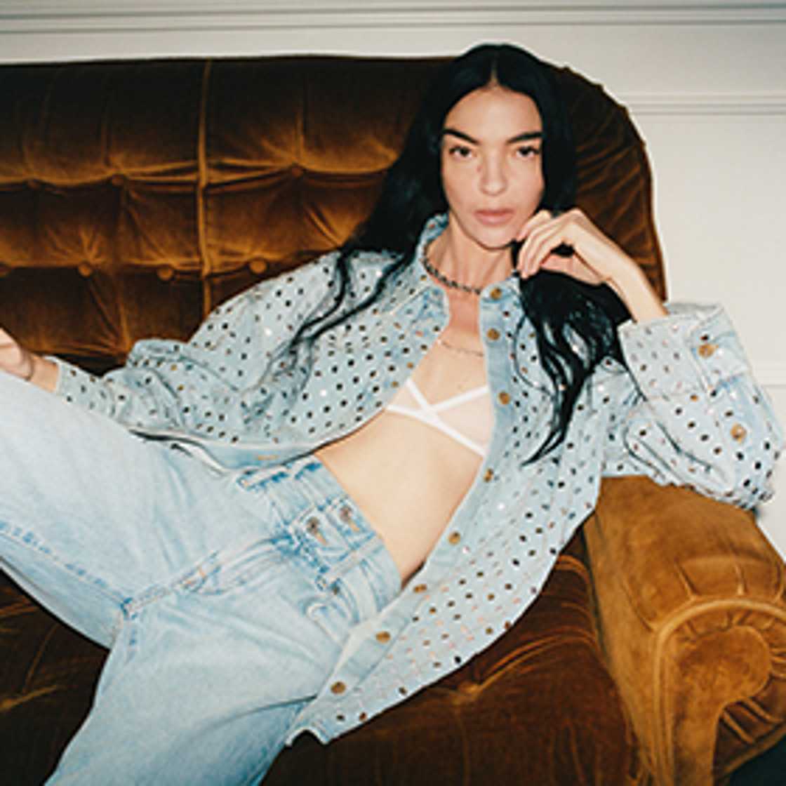 Lady on couch wearing denim