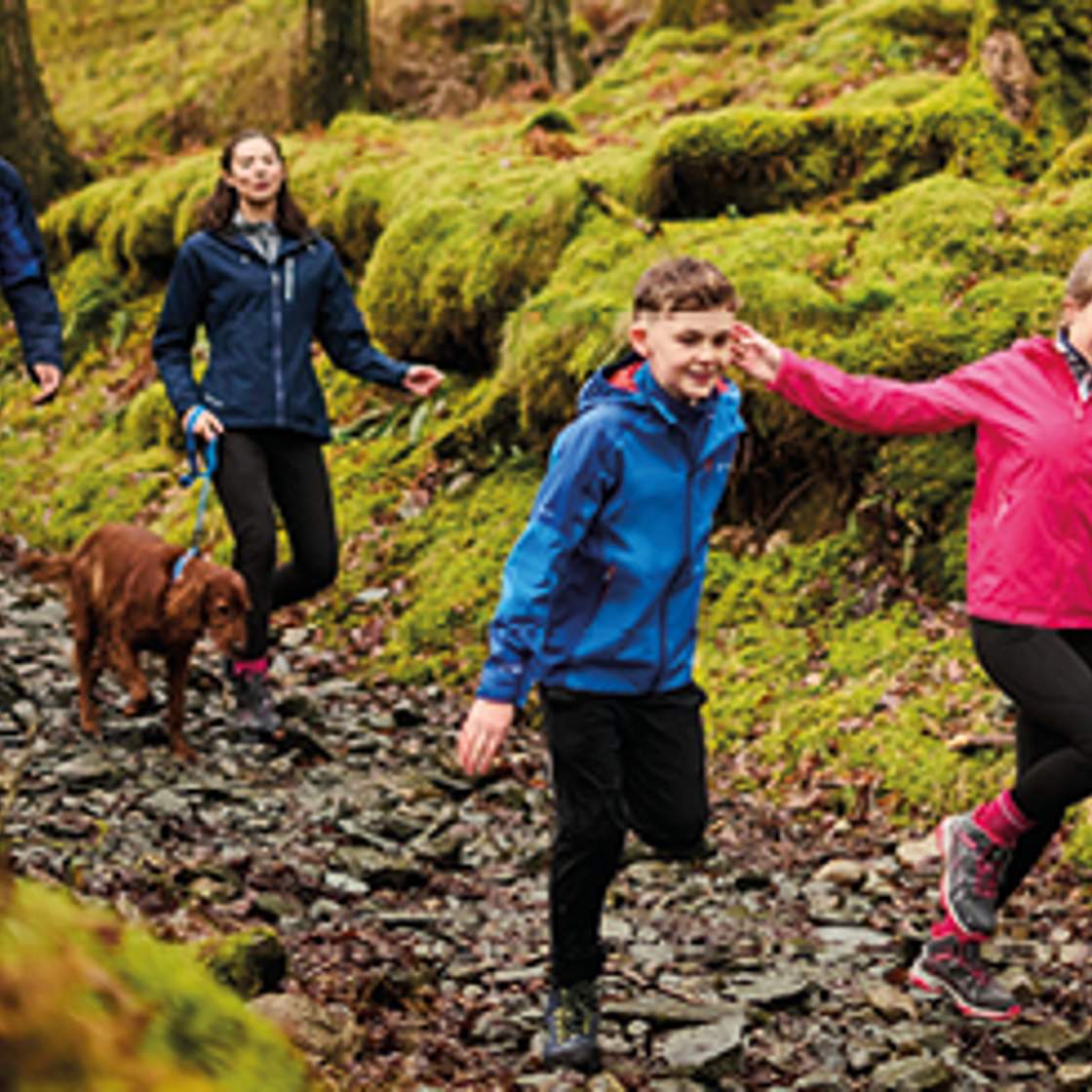 Regatta - A family wearing waterproofs hiking