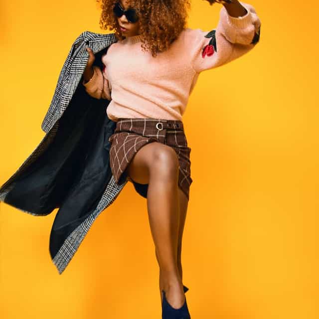 Lady with Coat over yellow background