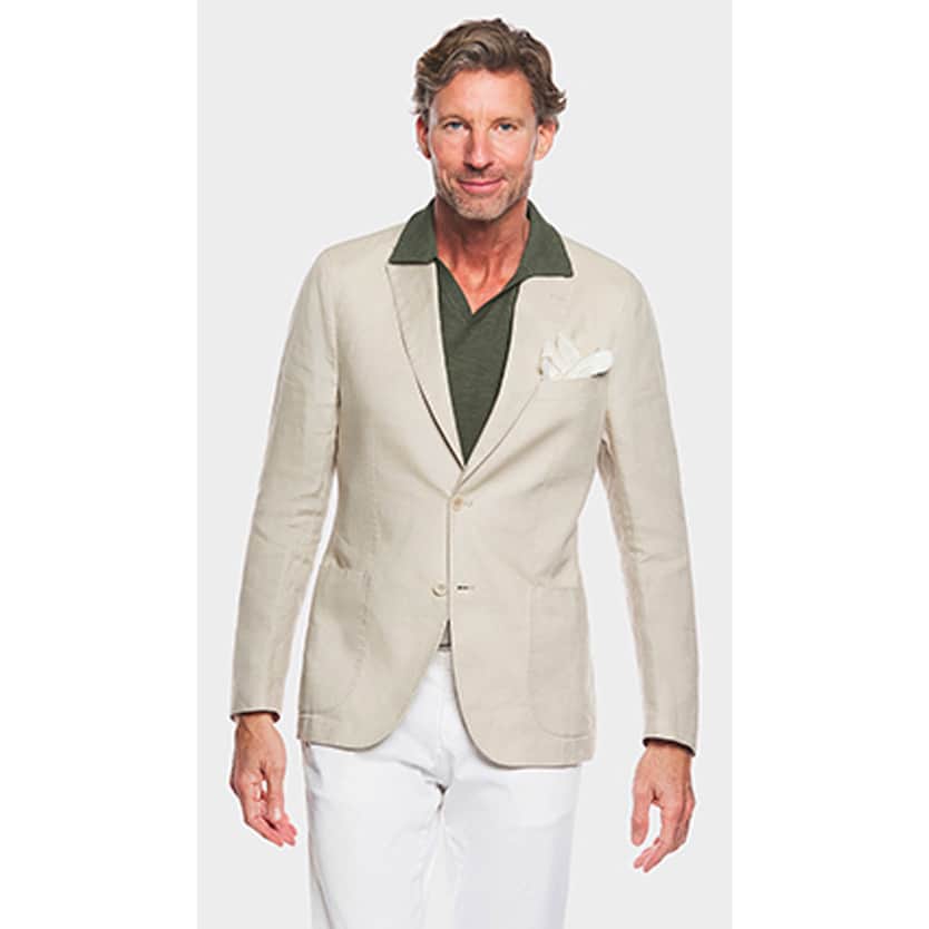 Scarpa man wearing a gree polo shirt and jacket