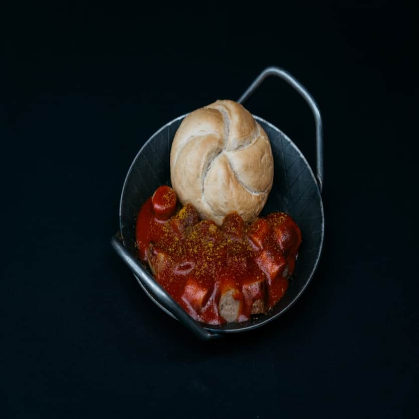 Curry Sausage with sauce in a pan