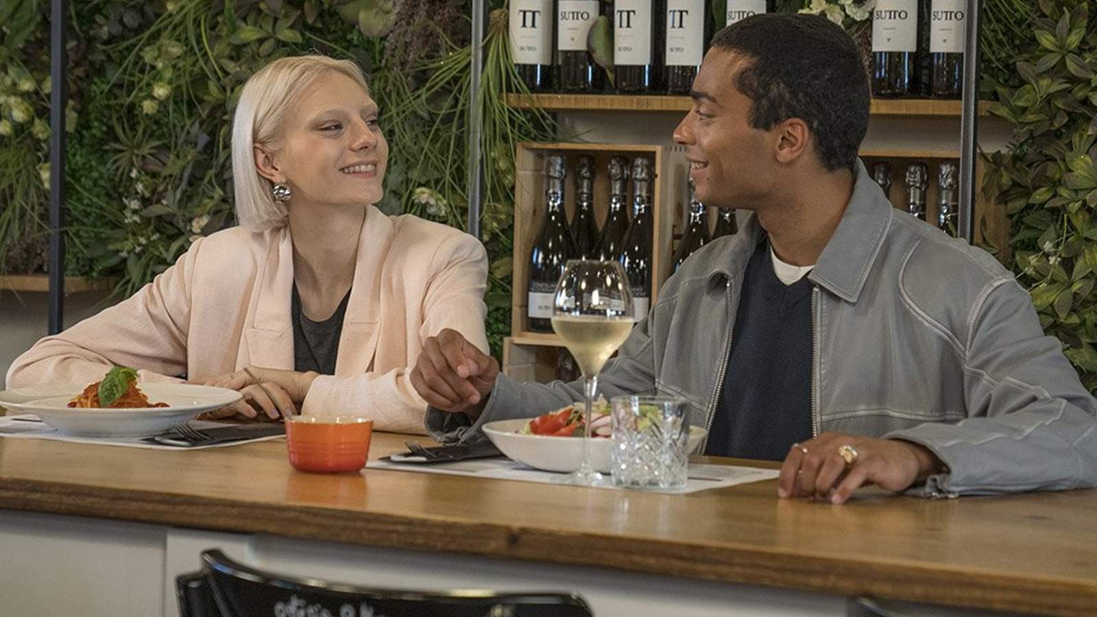 A couple sharing a pasta meal at a restaurant located at Noventa di Piave Designer Outlet.