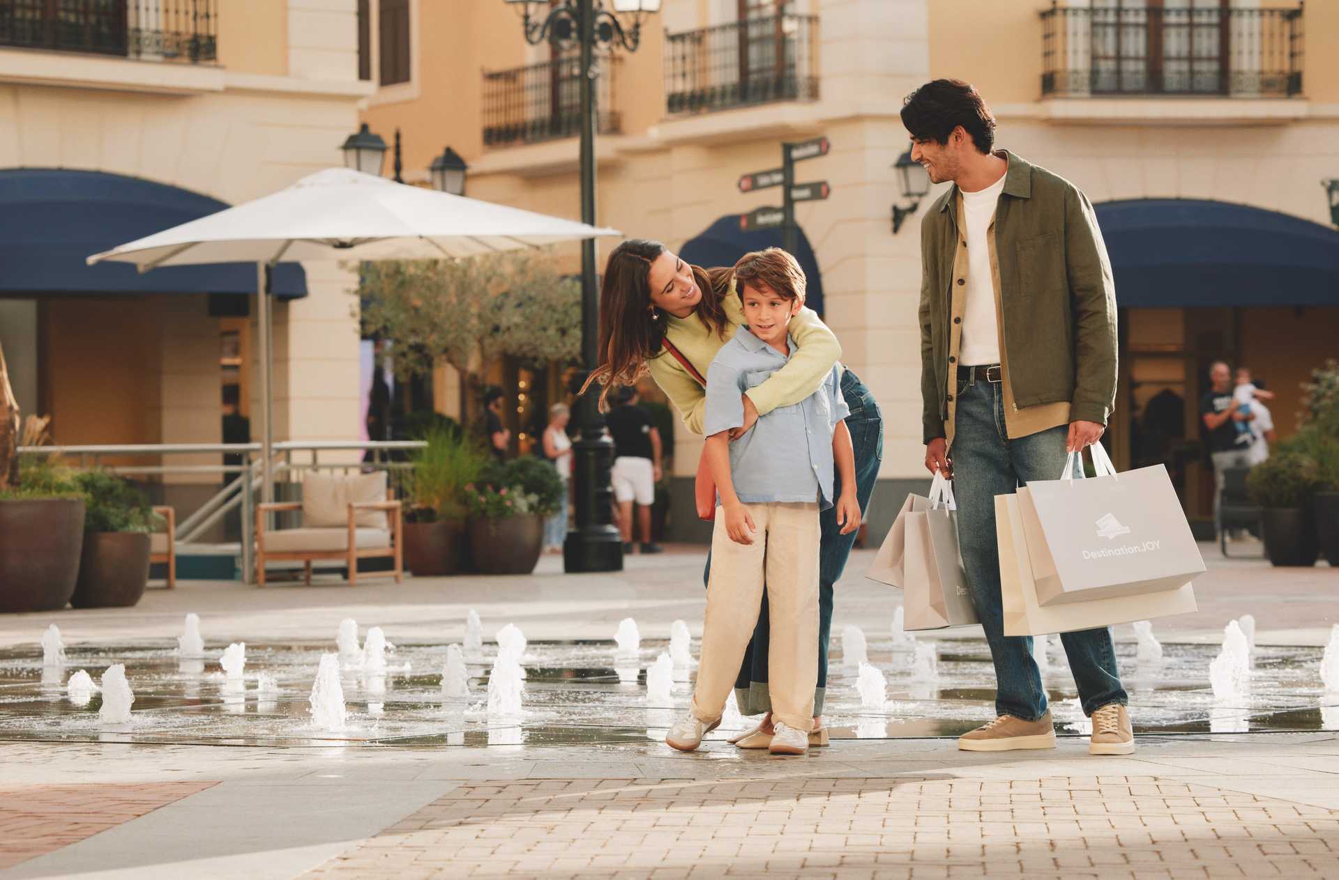 Family by the fountain in the main square