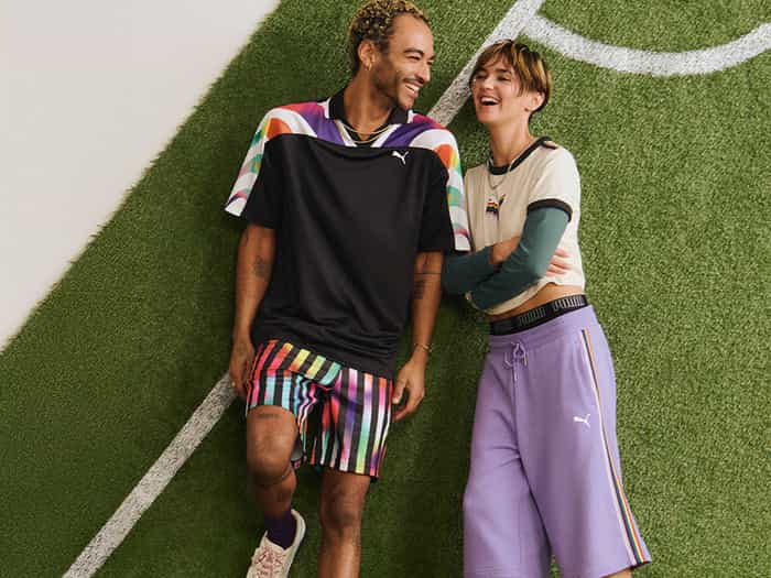 Two people lying down on the grass.